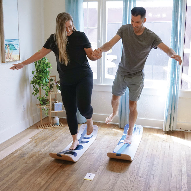 Two people using SlackBoards in a home setting